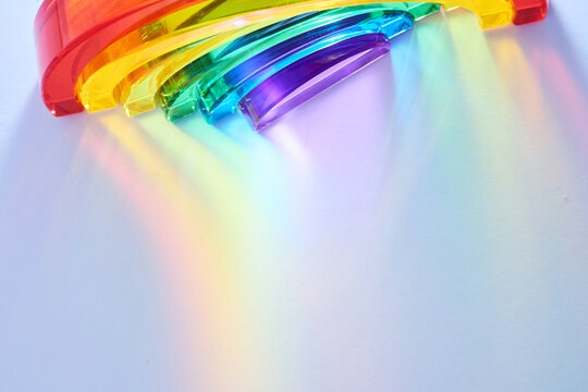 Rainbow spectrum light refracting through glass prism