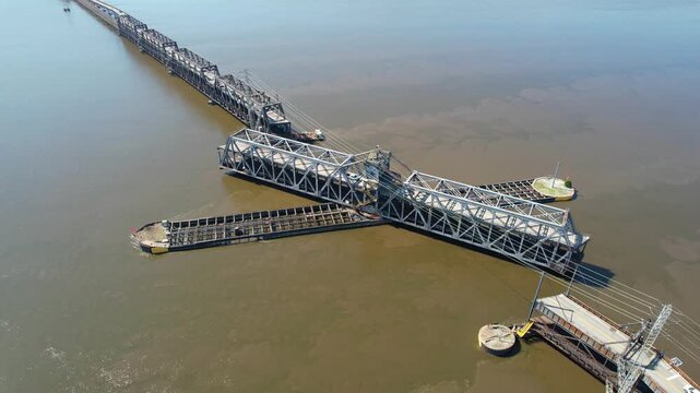 IOWA - 6.24.2024 - Great aerial view of a double-decked truss bridge swinging over the Mississippi River.