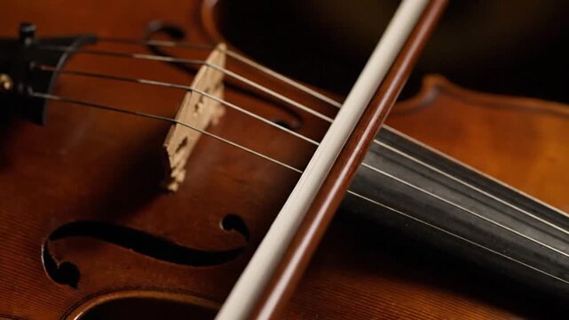 Bow Sliding Across Violin Strings Close-Up &ndash; Music Technique and Expression