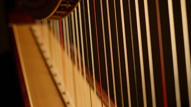 Harp Strings Glowing in Soft Light &ndash; Close-Up Musical Instrument Detail