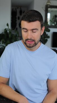 Man Looking at Camera with an Apologetic Expression and Pouting Face