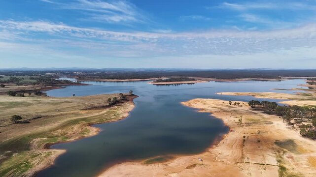 Dry reservoir landscape at Lake Eppalock with water skiing and fishing activities, Victoria