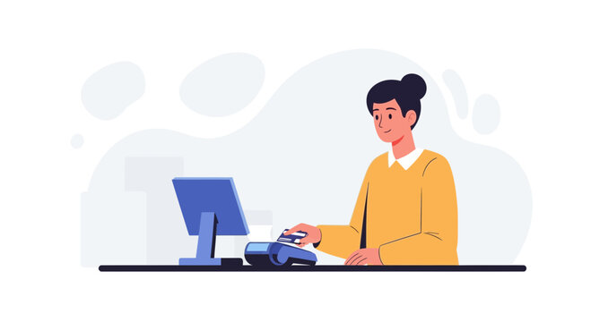 Cashier using credit card reader at checkout counter with computer screen