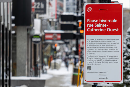 MONTREAL, CANADA, 25 December 2025 : Winter pause sign, Sainte-Catherine street, Montreal, urban scene, snow, city infrastructure