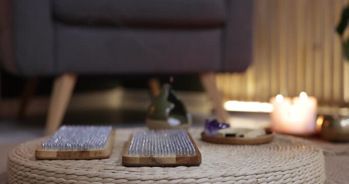 Pair of Sadhu boards on wicker pouf indoors, closeup