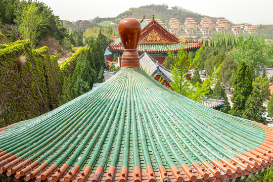 The Huayan Fountain Square and the Pilu Palace in the Nanshan scenic area of the Jiaodong Peninsula on a sunny summer day, Longkou, Yantai, Shandong, China