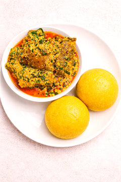 Egusi Soup with Eba in White Plate Overhead Shot