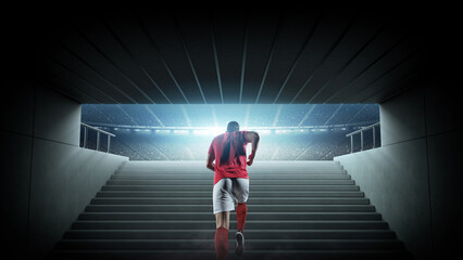 Football player walking through stadium tunnel toward the field. An imaginary stadium is modelled and rendered. © efks