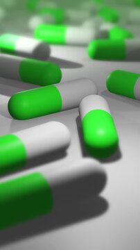  Camera Pans Across Cinematic Green and White Pill or Drug Capsules - Vertical