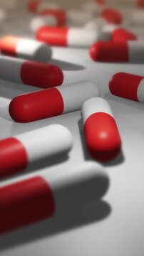  Camera Pans Across Cinematic Red and White Pill or Drug Capsules - Vertical