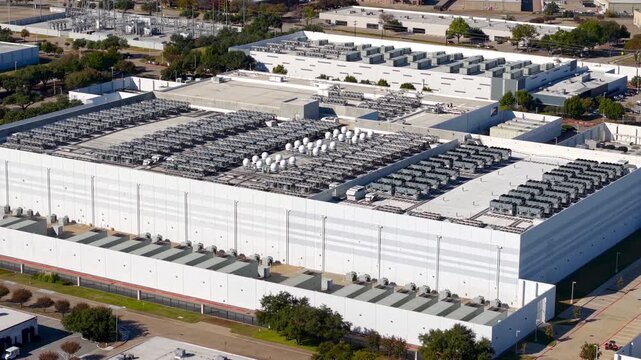 Aerial view of a large data center and its cooling systems
