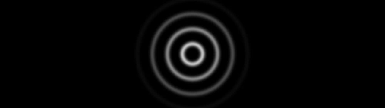 Concentric circles with soft focus and glow on a black background Keywords: concentric circles, rings, target, bullseye, ripple, wave, sound wave, signal, broadcast, communication, abstract