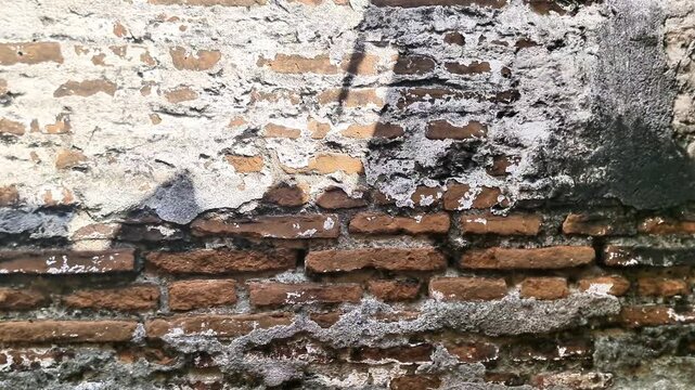 Ancient Colonial Heritage Brick Wall Texture  Weathered Historic Masonry Background with Peeling Plaster