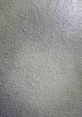 Fototapeta premium Top view of the cement textured surface of the wall which is characterized by its rough and uneven quality