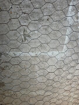 Hexagonal Chicken Wire Mesh on Wooden Background