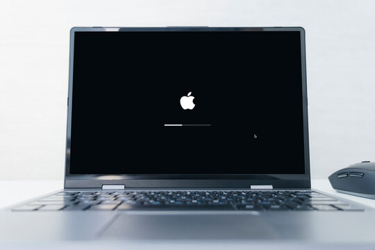 Apple logo in the screen of laptop.