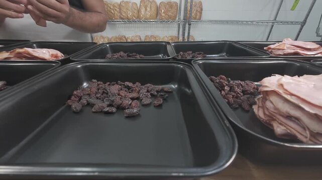 Mise en place of ham and raisins for the pan de jamon in bakery