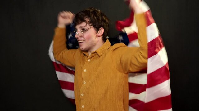 A football fan rejoices at his team's victory and shouts hurray.