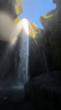Gljufrabui waterfall hidden inside a canyon, viewed from inside the gorge, South Iceland
