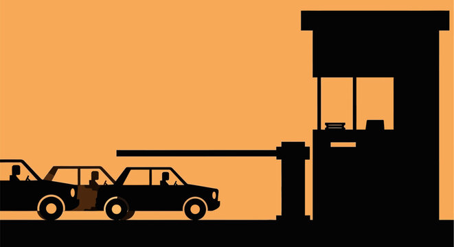 Silhouette of cars passing through security gate with booth at sunset