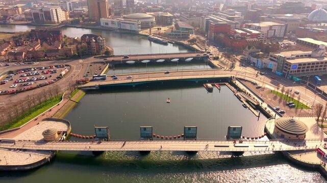 Overhead 4K 60FPS aerial video of the River Lagan and Lagan Bridges in Belfast City Centre in Belfast, Northern Ireland. Produced in 3840x2160 ratio with Rec709 color.