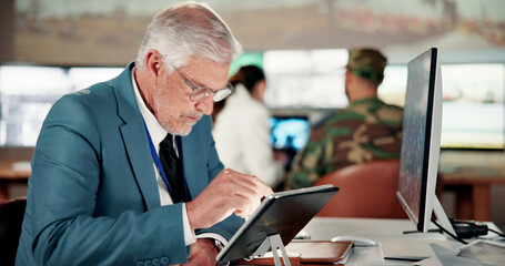 Fototapeta premium Planning, search and tablet with man in military base for administration, review or war strategy. App, scrolling and target location with mature person in army command center for attack coordination