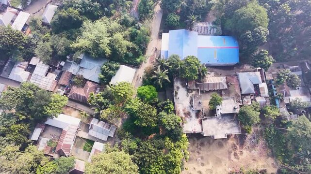 Luxury villa with infinity pool surrounded by lush tropical forest aerial drone view summer paradise