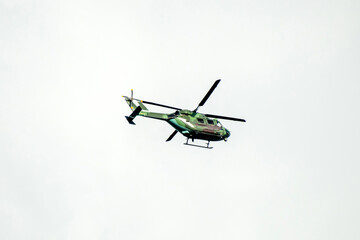 Fototapeta premium Helicopter formation against isolated cloudy mid sky
