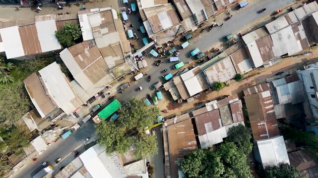 aerial view of a bustling market street in a densely populated urban area