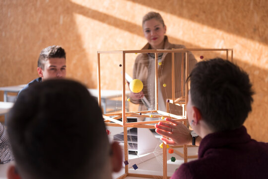 Architecture Students Working on Structural Model Project