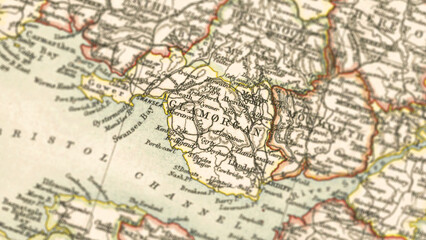 Obraz premium Macro View of Vintage Map Highlighting Glamorganshire Wales with Detailed Regional Cartography