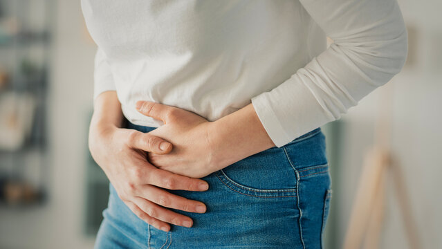 Young woman with stomach ache