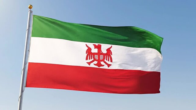 Flag of the republic of mahabad waving in the wind against a clear blue sky 4k video