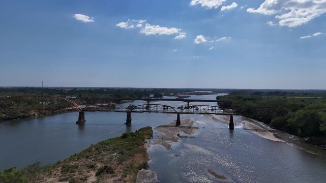 Aerial view of old railway and new highway bridges over Lempa River, El Salvador, infrastructure network