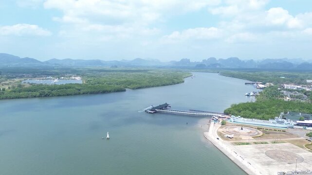 Aerial view of the HTMS Lanta warship museum featuring a decommissioned naval ship and aircraft display near Klong Jilad Ferry Pier in Krabi Thailand coastal area.
Surrounded by stunning nature.