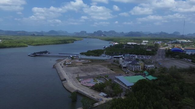 Aerial view of the HTMS Lanta warship museum featuring a decommissioned naval ship and aircraft display near Klong Jilad Ferry Pier in Krabi Thailand coastal area.
Surrounded by stunning nature.