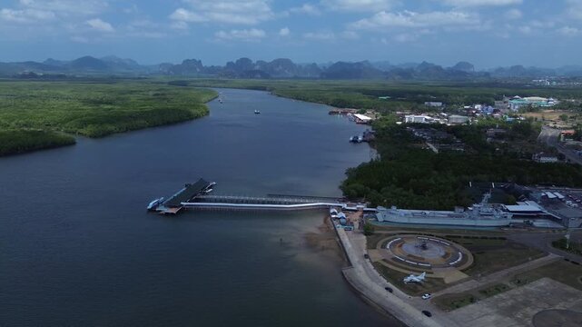Aerial view of the HTMS Lanta warship museum featuring a decommissioned naval ship and aircraft display near Klong Jilad Ferry Pier in Krabi Thailand coastal area.
Surrounded by stunning nature.