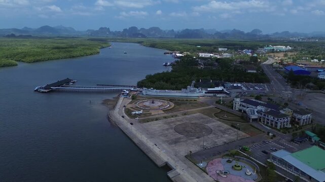 Aerial view of the HTMS Lanta warship museum featuring a decommissioned naval ship and aircraft display near Klong Jilad Ferry Pier in Krabi Thailand coastal area.
Surrounded by stunning nature.