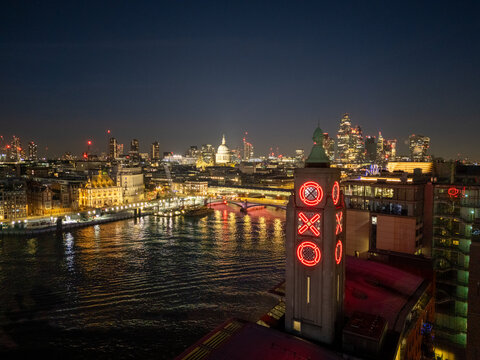London, UK. OXO Tower and St Pauls Cathedral over River Thames at Twilight. Aerial London Skyline with illuminated city lights