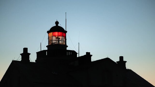 Close view of Stora Karls&ouml; lighthouse with flashing beacon at dusk over the Baltic Sea, Gotland, Sweden