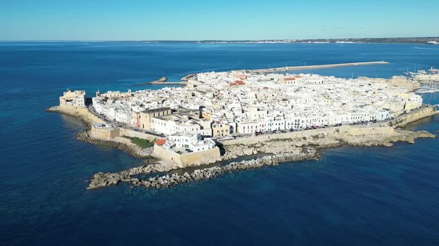 Aerial view of Gallipoli old town with fort, ramparts and harbor, Puglia, south Italy