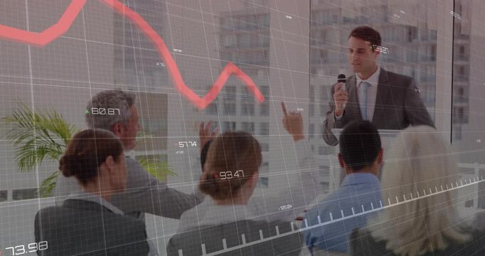 Presenter speaking and gesturing after audience raises hands, explaining red line dip and recovery
