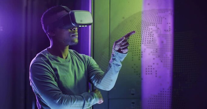 Man wearing VR headset uncrossing arms and tapping panel, navigating dotted world-map in tech demo