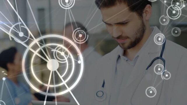 Male clinician scrolling tablet, camera moving to face, HUD rings pulsing, revealing patient data