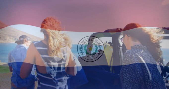 Walking five travelers from convertible to coast to view ocean after grabbing bags, Paraguayan flag