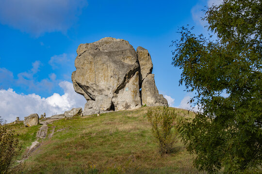 Ancient Devil&rsquo;s Rock and stone crosses in Pidkamin village