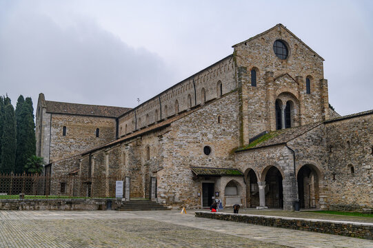 Romanesque Basilica of Santa Maria Assunta with stone portico in Aquileia, Friuli Venezia Giulia, Italy

