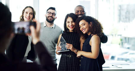 Woman, team and photo with award at office for goals, achievement and support at legal advisory agency. People, group and profile picture with celebration, trophy and diversity at corporate law firm © peopleimages.com