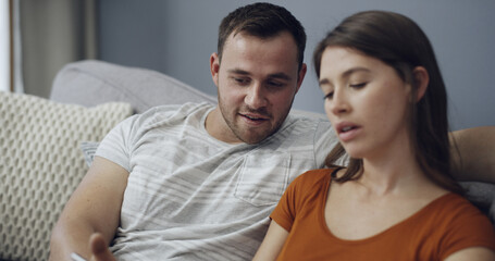 Obraz premium Relax, man and couple with phone on sofa for online video, social media post and bonding together. Support, people or smartphone in home for streaming subscription, internet browsing or weekend break