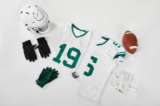 American football jerseys helmet gloves and ball in top view layout